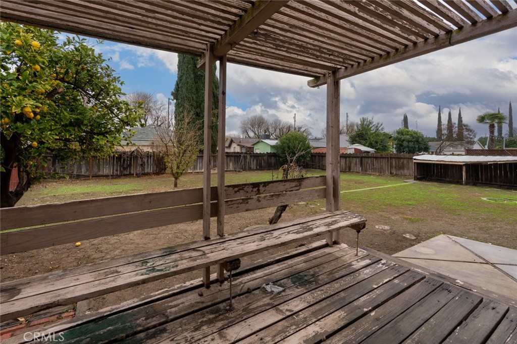 358 Sycamore Avenue Gustine, CA 95322 - Photo 28 of 37 a backyard of a house with a garden table and chairs