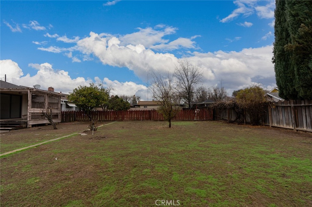 358 Sycamore Avenue Gustine, CA 95322 - Photo 33 of 37 a backyard of a house with lots of green space and lake view