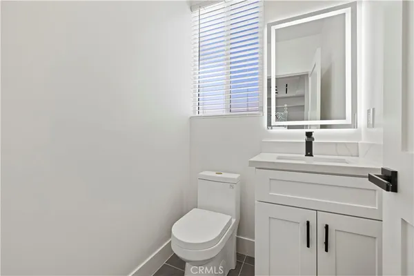 a view of a bathroom with a sink and a mirror