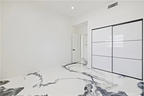 a bathroom with a sink vanity and a mirror