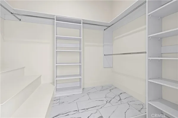 a view of a sink and dishwasher with wooden floor