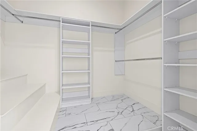 a view of a sink and dishwasher with wooden floor