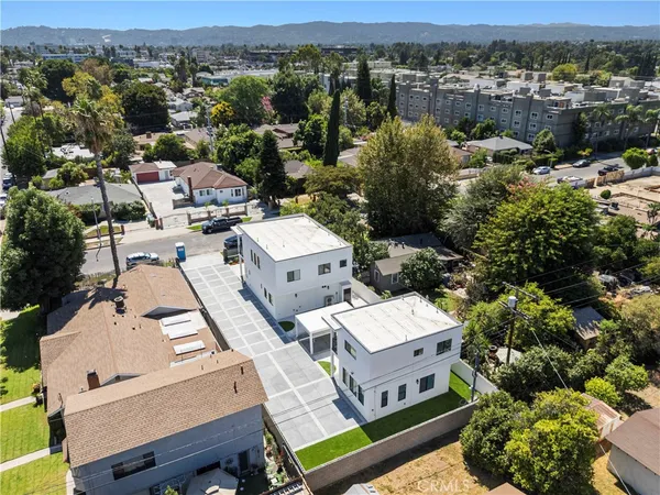 an aerial view of a house with a mountain view