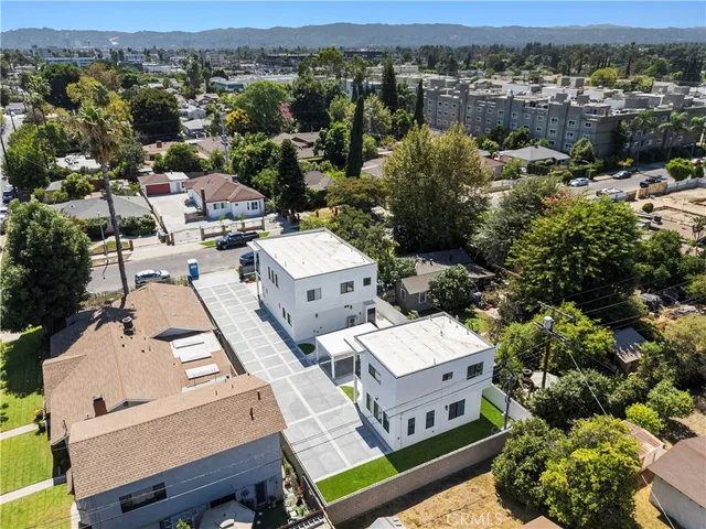an aerial view of a house with a mountain view