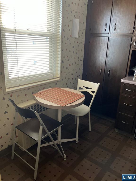 280 Prospect Avenue, Unit 11H Hackensack, NJ 07601 - Photo 8 of 20 a view of a dining room with furniture and a window