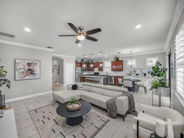 a view of a workspace with furniture and wooden floor
