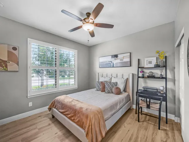 a living room with a large window and a table