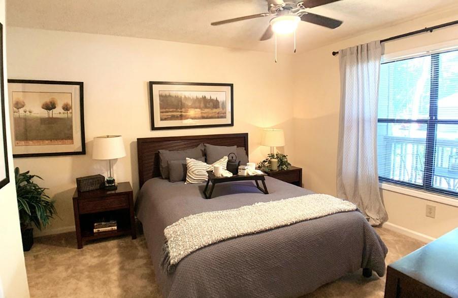3450 K Jones Mill Road, Unit 218 Norcross, GA 30092 - Photo 9 of 29 a bedroom with bed and a window