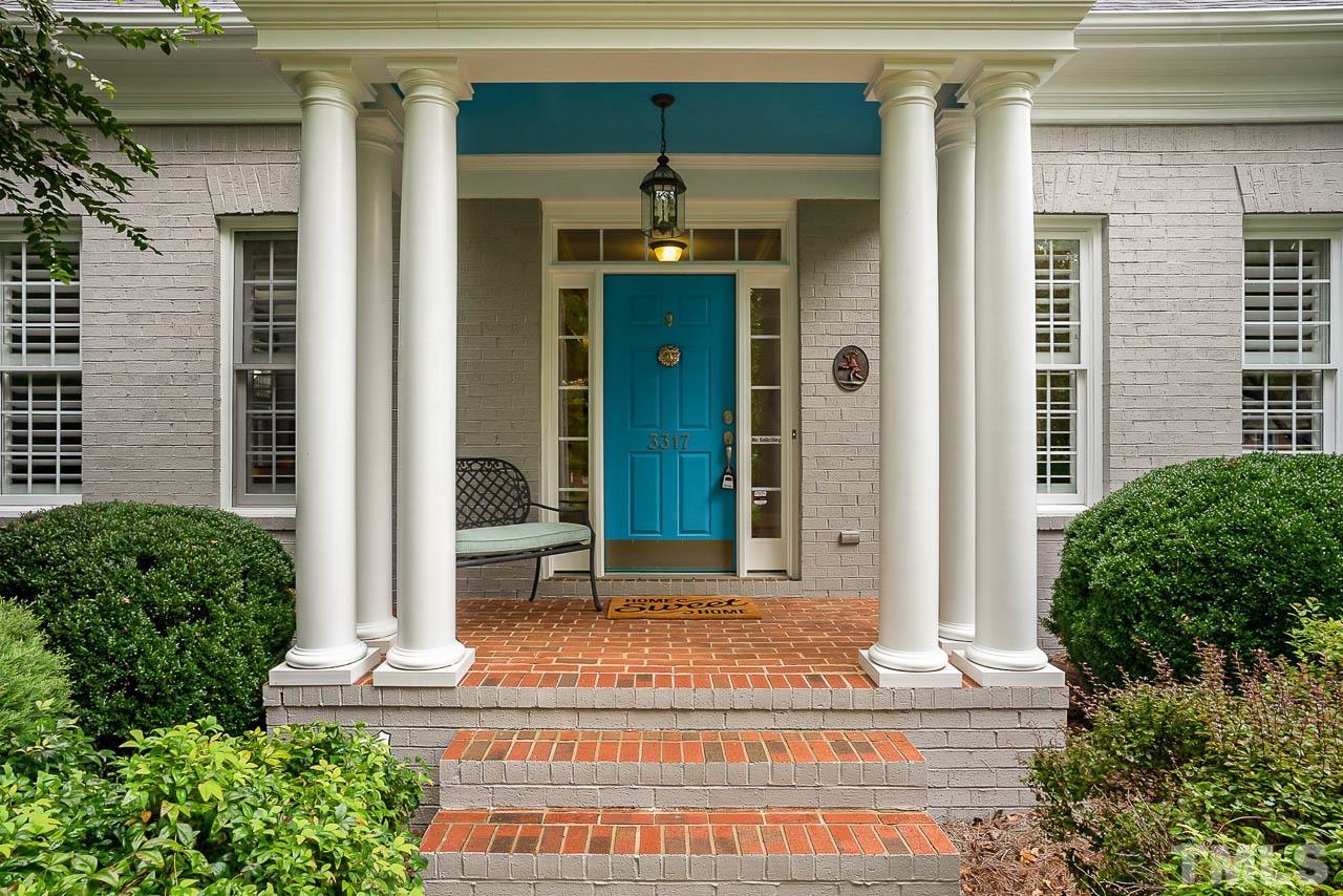 3317 Tall Tree Place Raleigh, NC 27607 - Photo 2 of 3 a front view of a house with a porch