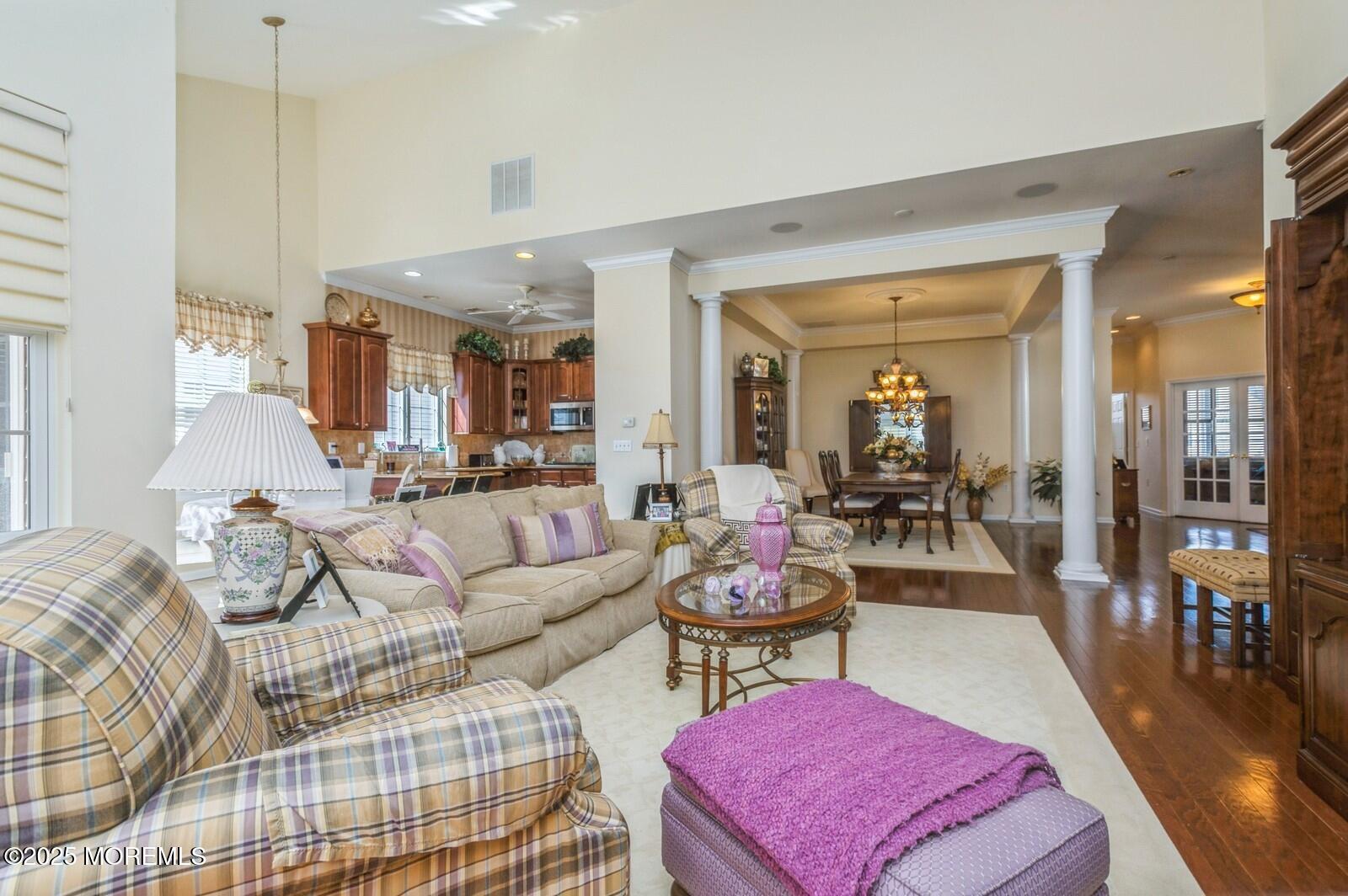 15 Eagleswood Drive Waretown, NJ 08758 - Photo 15 of 27 a living room with furniture a rug and a table