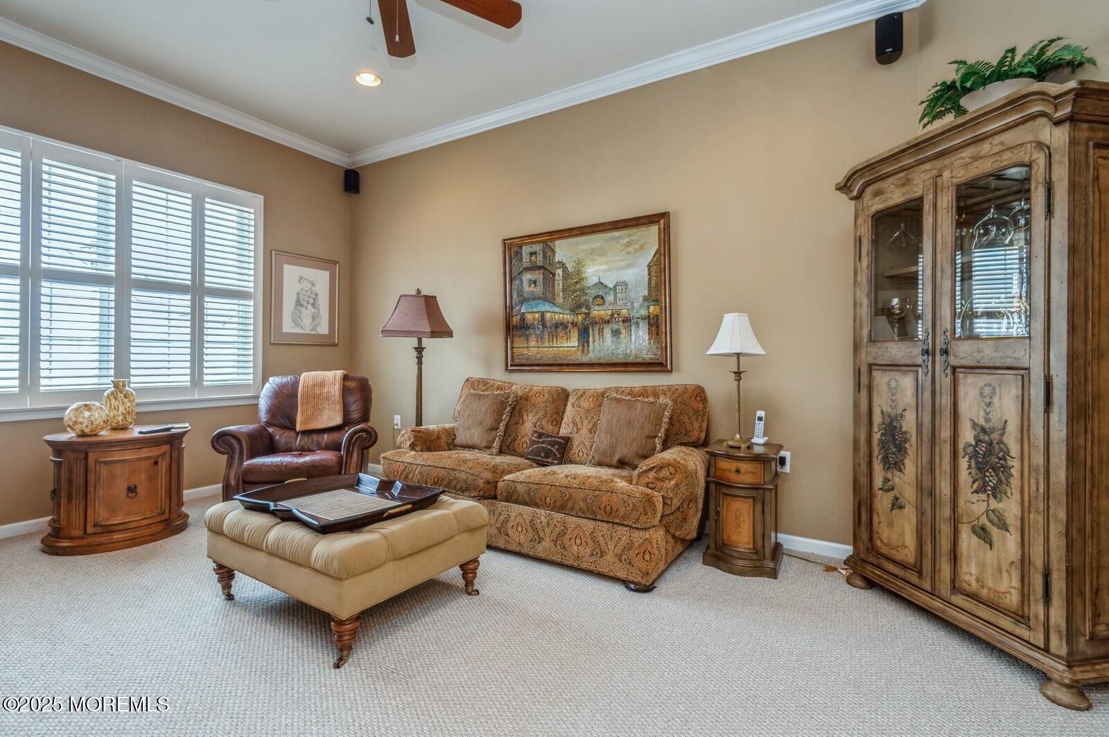 15 Eagleswood Drive Waretown, NJ 08758 - Photo 17 of 27 a living room with furniture and a fireplace