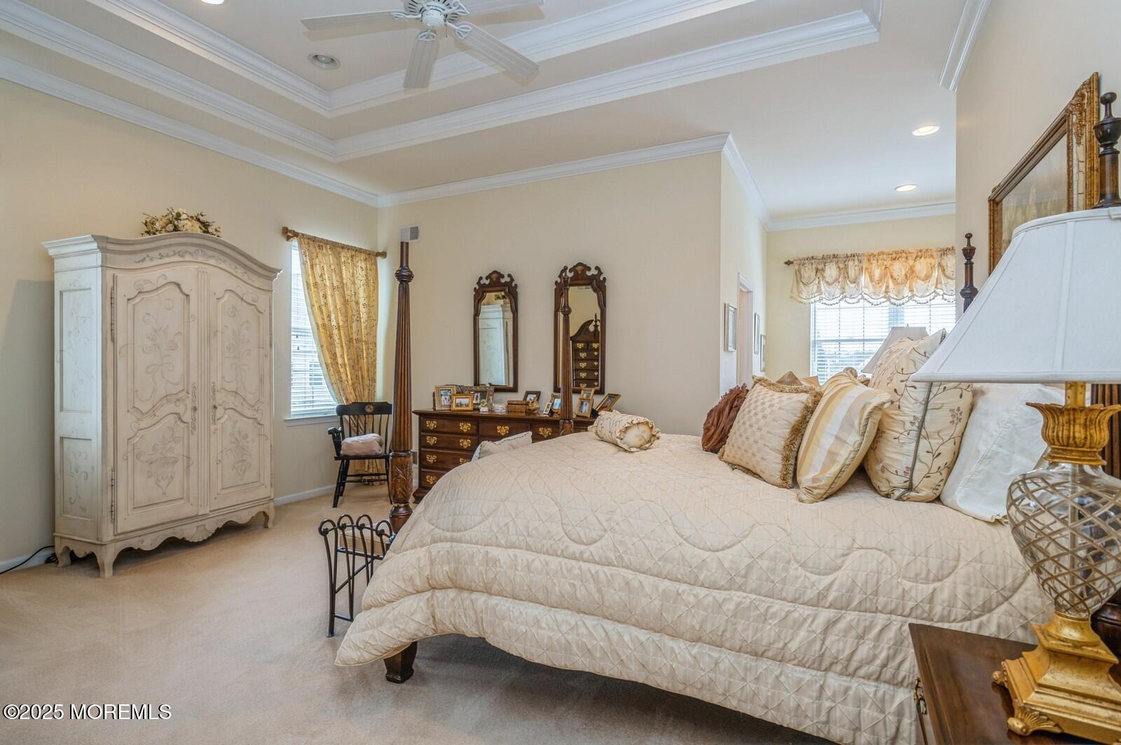 15 Eagleswood Drive Waretown, NJ 08758 - Photo 18 of 27 a bedroom with a bed a mirror and lamp