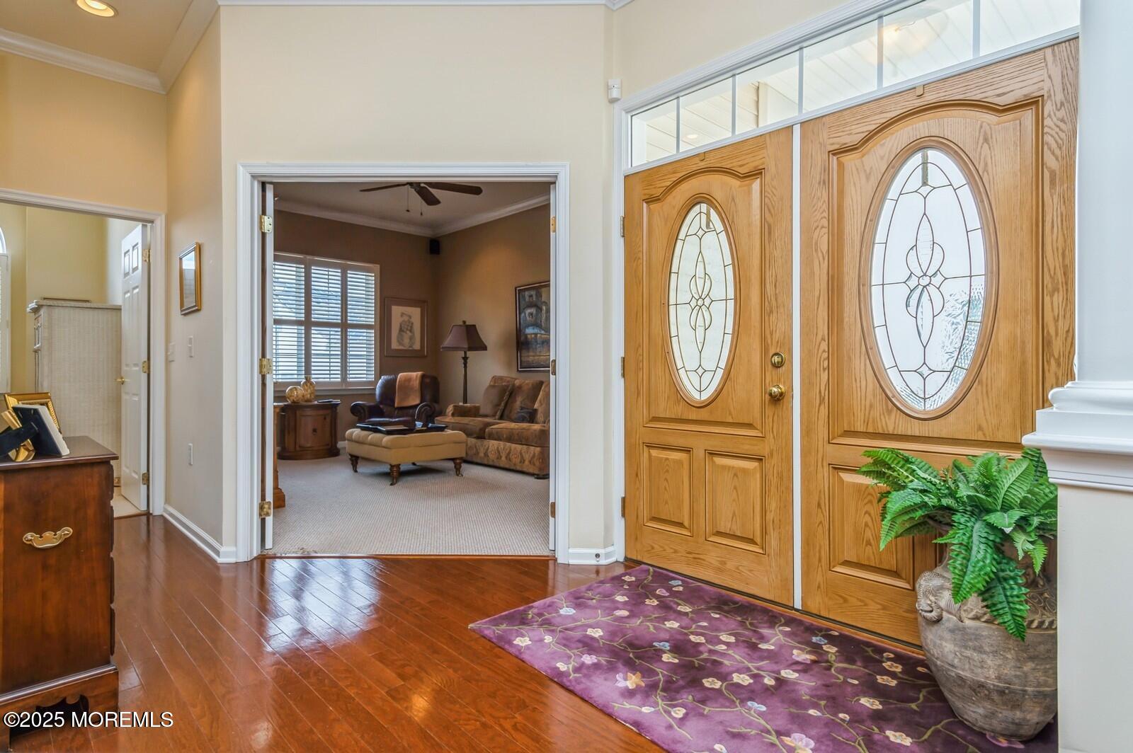 15 Eagleswood Drive Waretown, NJ 08758 - Photo 2 of 27 a view of a hallway with entryway dining room and livingroom view