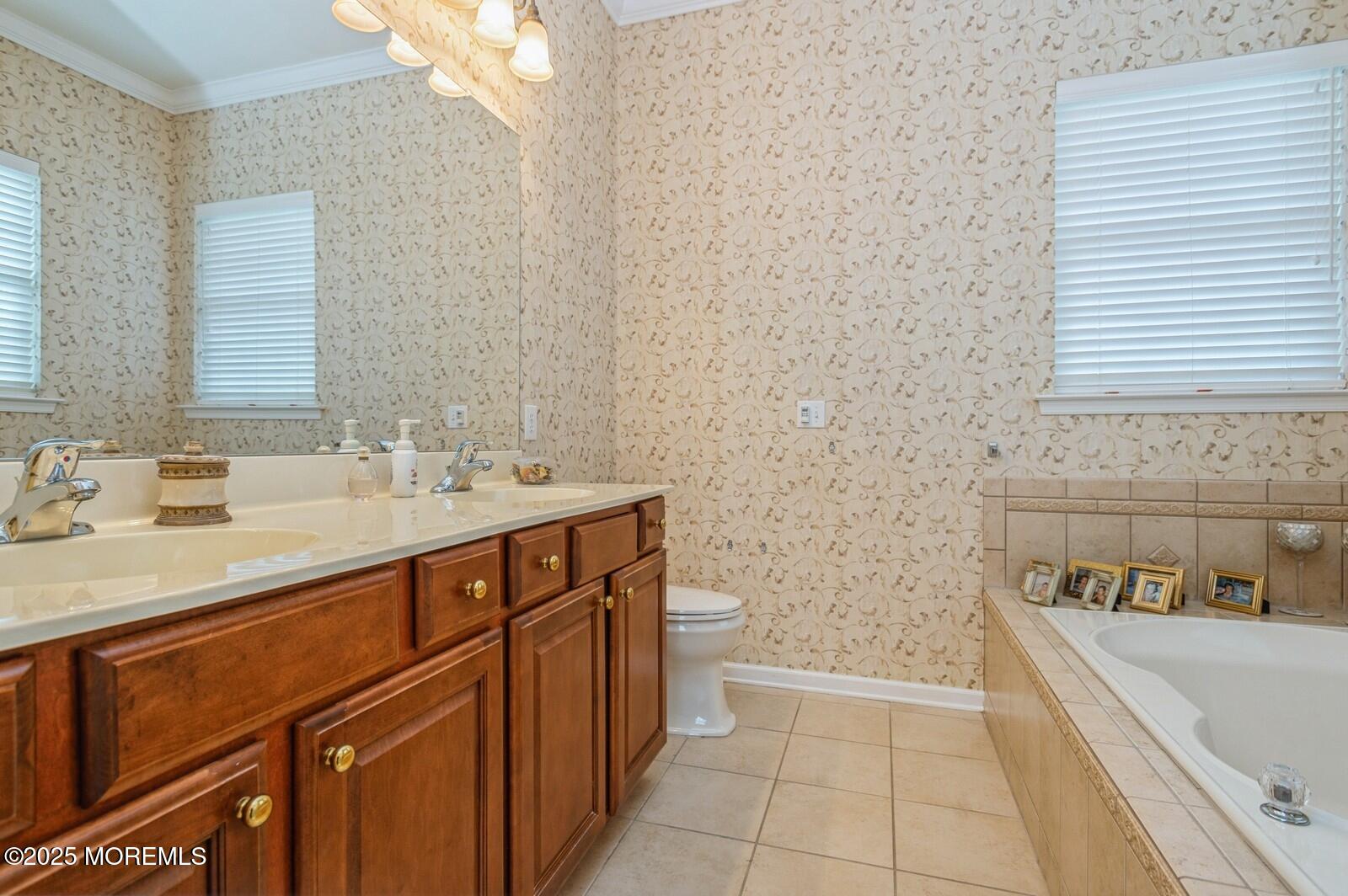 15 Eagleswood Drive Waretown, NJ 08758 - Photo 21 of 27 a bathroom with a tub sink and mirror