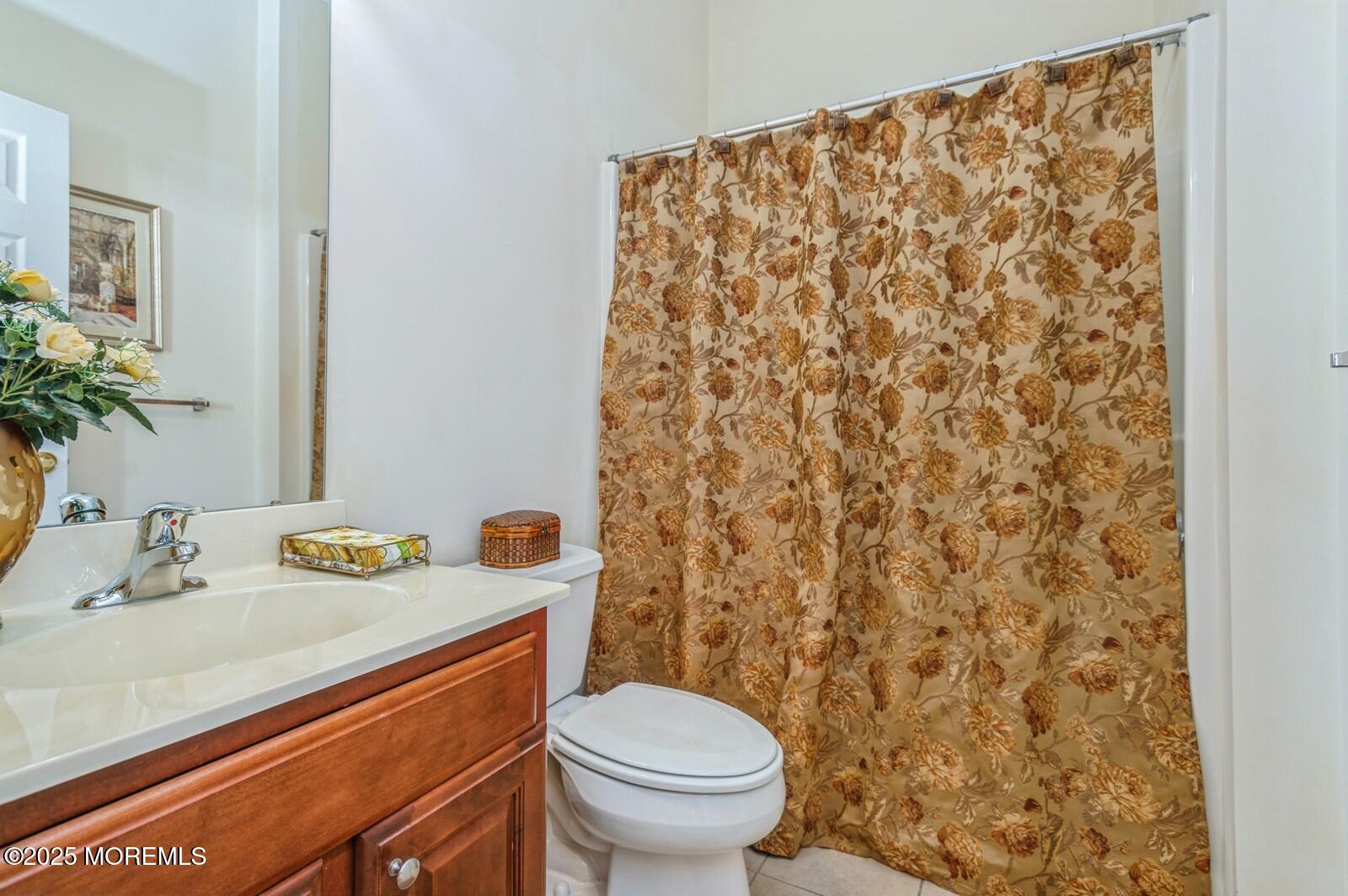 15 Eagleswood Drive Waretown, NJ 08758 - Photo 24 of 27 a bathroom with a sink toilet and a mirror
