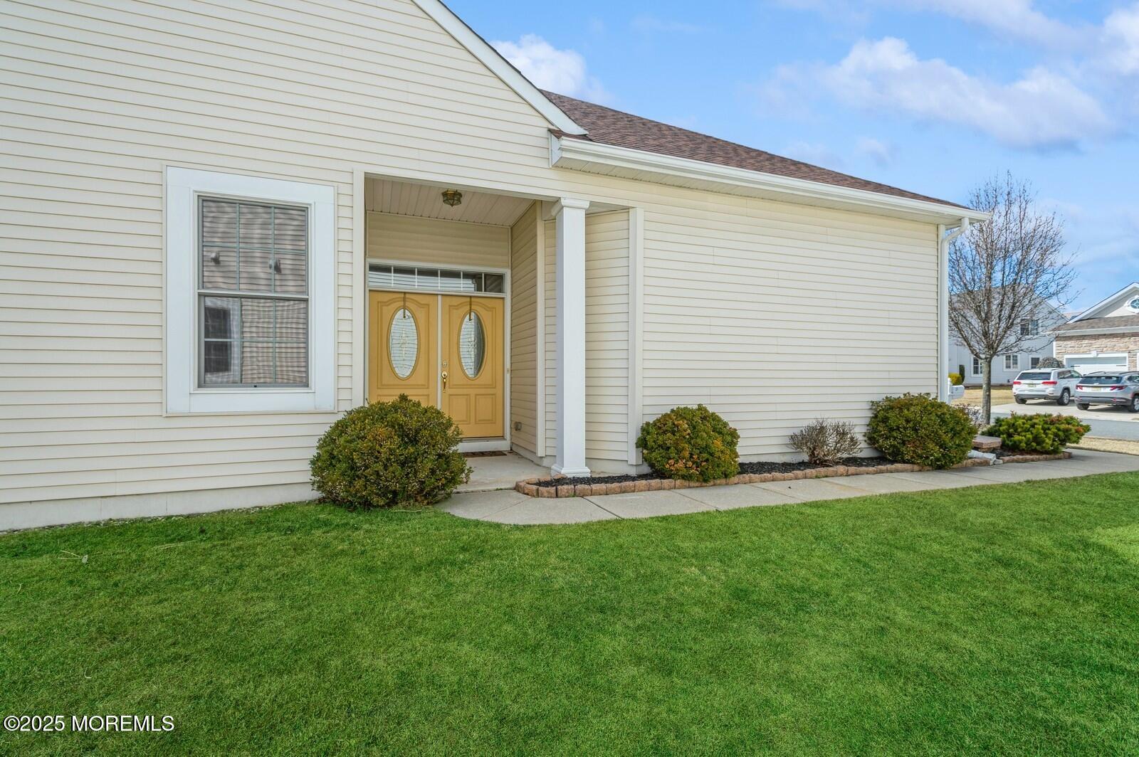 15 Eagleswood Drive Waretown, NJ 08758 - Photo 25 of 27 a house that has a big yard in front of it