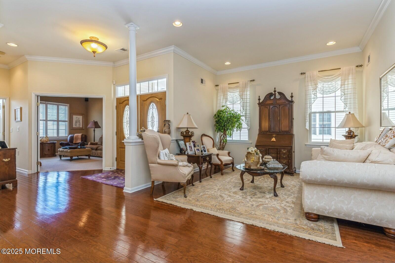 15 Eagleswood Drive Waretown, NJ 08758 - Photo 6 of 27 a living room with fireplace furniture and a wooden floor