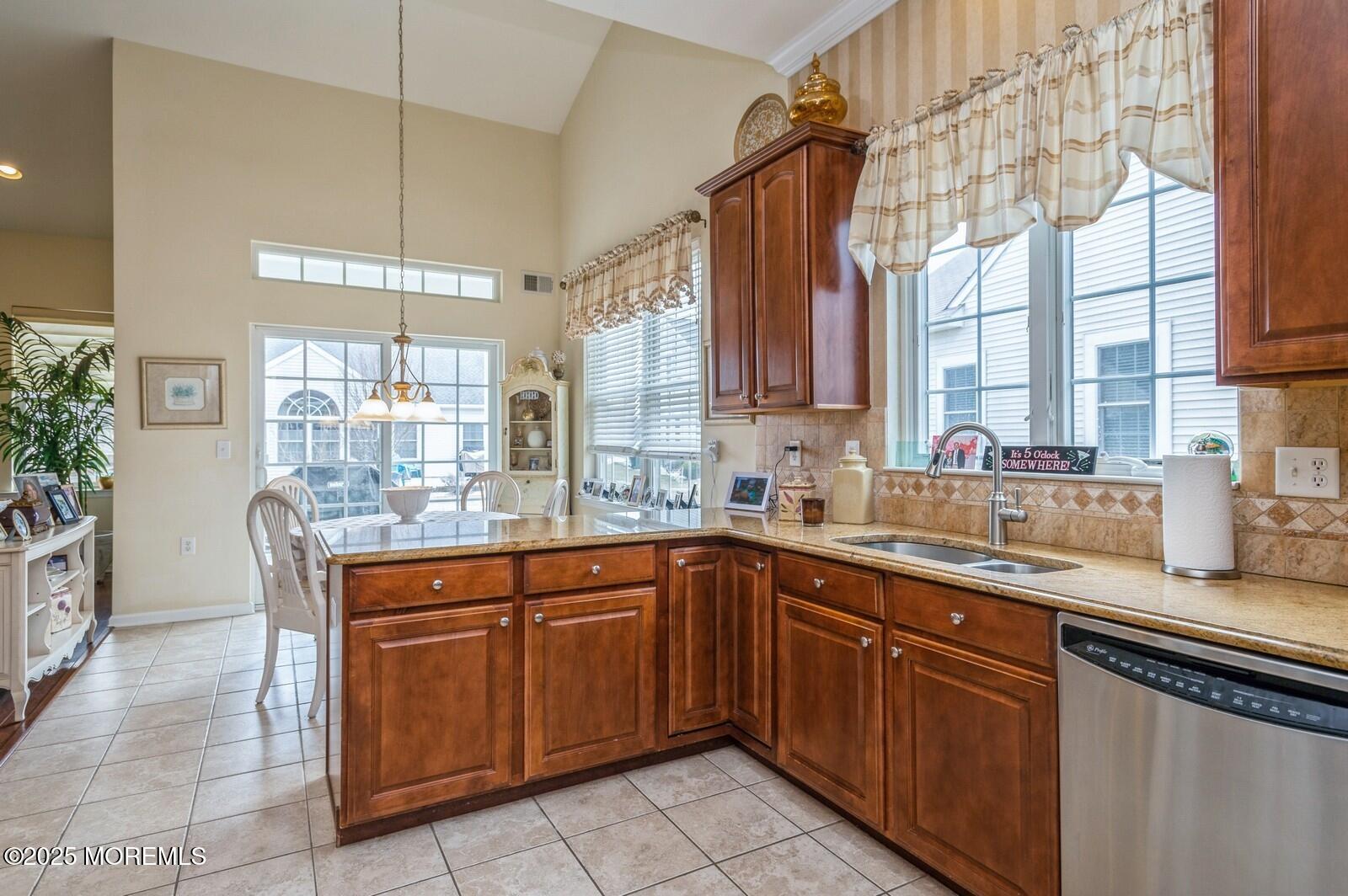 15 Eagleswood Drive Waretown, NJ 08758 - Photo 9 of 27 a kitchen with a sink window and cabinets