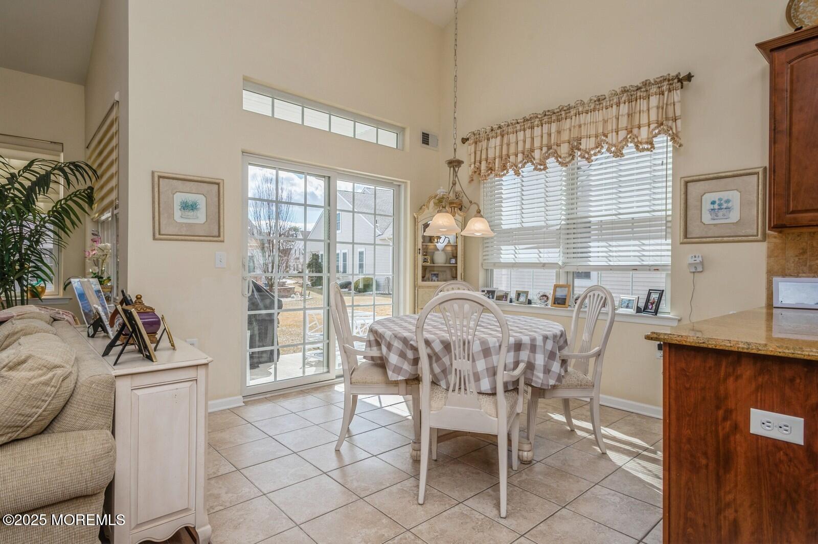 15 Eagleswood Drive Waretown, NJ 08758 - Photo 10 of 27 a view of a dining room with furniture window and outside view