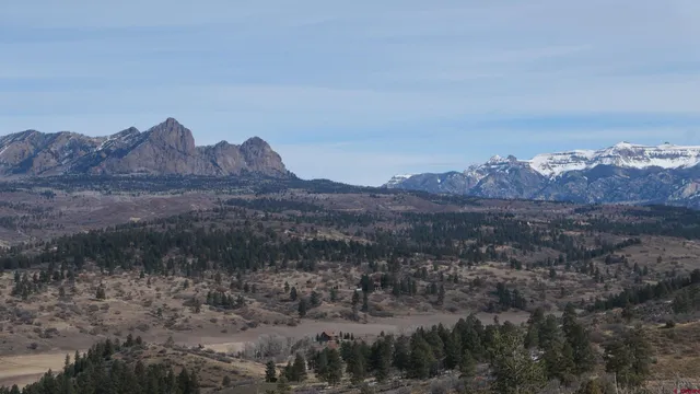 a view of a house with a field