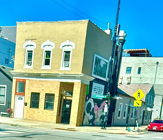 a view of a building with a street