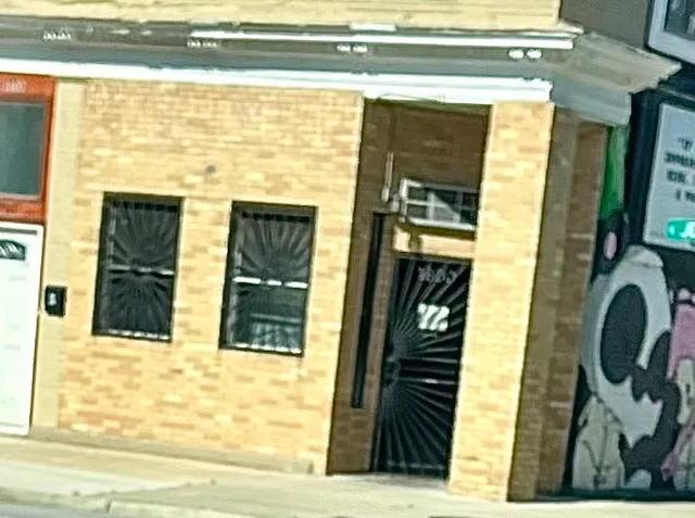 a view of a door of the house with a street