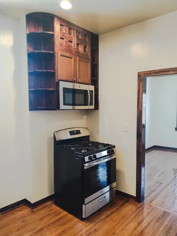 a room with a closet and wooden floor
