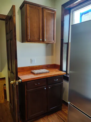a view of a room with pool table and windows