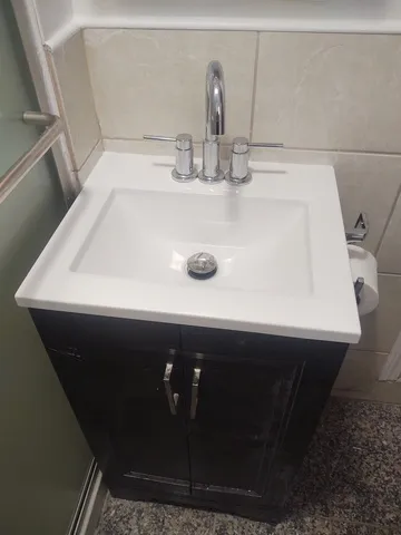 a stove top oven sitting inside of a kitchen