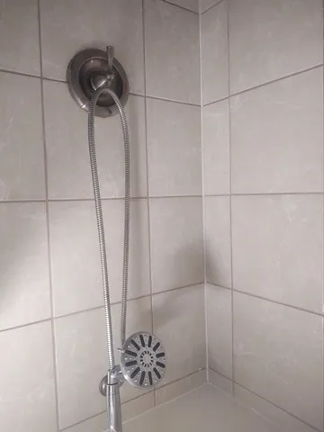 a view of a hallway view with wooden floor and staircase