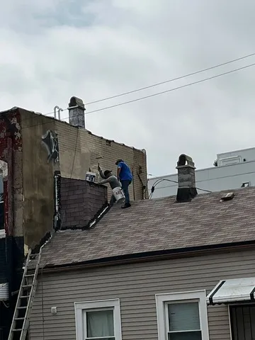 a view of a room with wooden floor and door