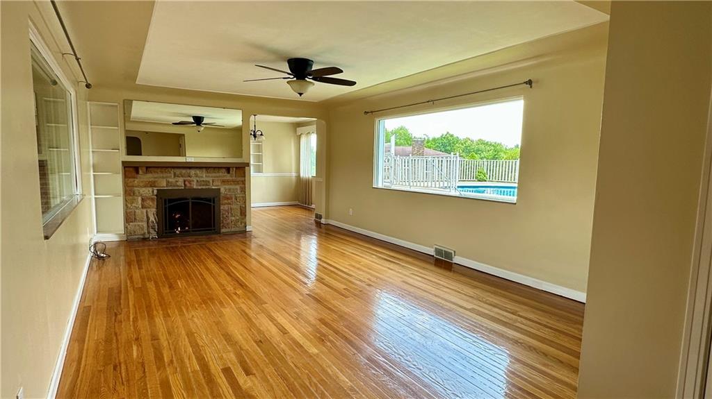 2231 Dellenbaugh Road Tarentum, PA 15084 - Photo 16 of 50 a view of an empty room with wooden floor a fireplace and a window