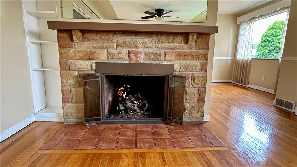 2231 Dellenbaugh Road Tarentum, PA 15084 - Photo 19 of 50 a room with fireplace and wooden floor