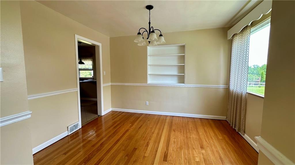 2231 Dellenbaugh Road Tarentum, PA 15084 - Photo 20 of 50 a view of empty room with wooden floor and windows