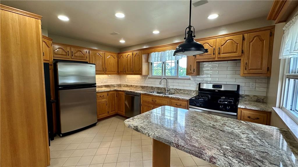 2231 Dellenbaugh Road Tarentum, PA 15084 - Photo 22 of 50 a kitchen with granite countertop a sink stainless steel appliances and cabinets