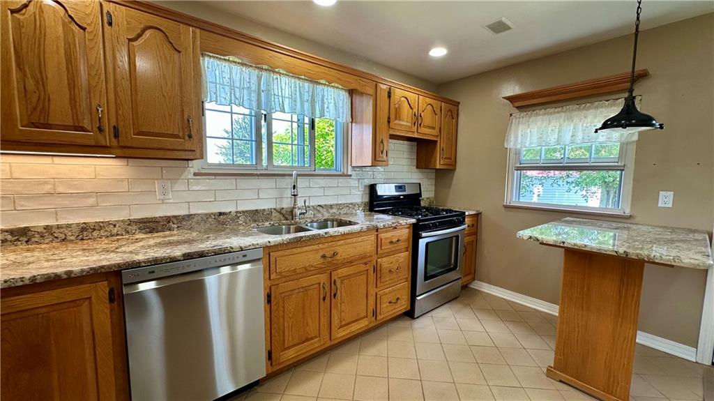 2231 Dellenbaugh Road Tarentum, PA 15084 - Photo 24 of 50 a kitchen with a sink window and cabinets
