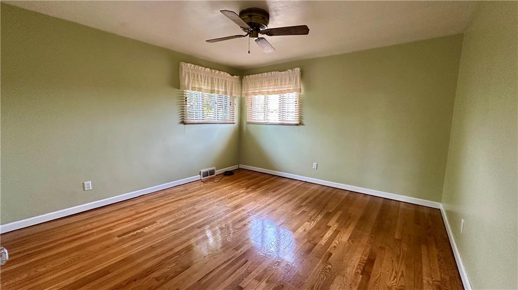 2231 Dellenbaugh Road Tarentum, PA 15084 - Photo 28 of 50 a view of empty room with wooden floor and fan