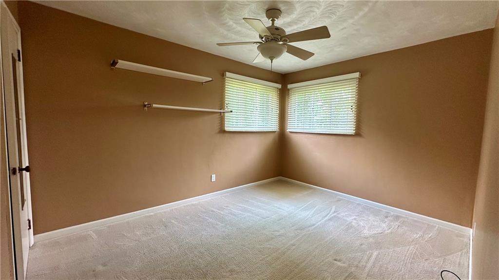 2231 Dellenbaugh Road Tarentum, PA 15084 - Photo 29 of 50 an empty room with a ceiling fan and a window