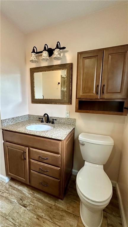 2231 Dellenbaugh Road Tarentum, PA 15084 - Photo 33 of 50 a bathroom with a granite countertop toilet sink and mirror