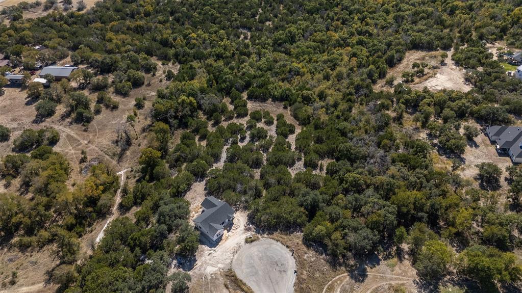 Tbd Tbd Tbd Weatherford, TX 76085 - Photo 9 of 13 with view of a forest with a yard and trees