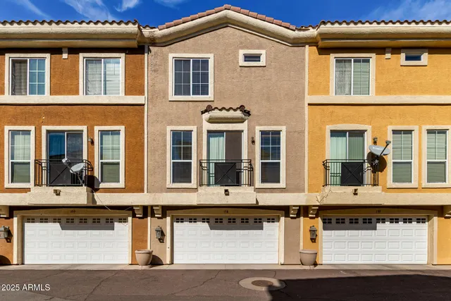 a front view of residential houses with street
