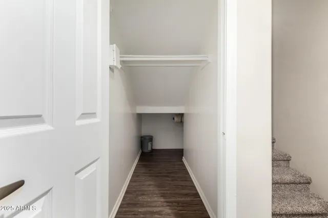 a view of a hallway with the wooden floor