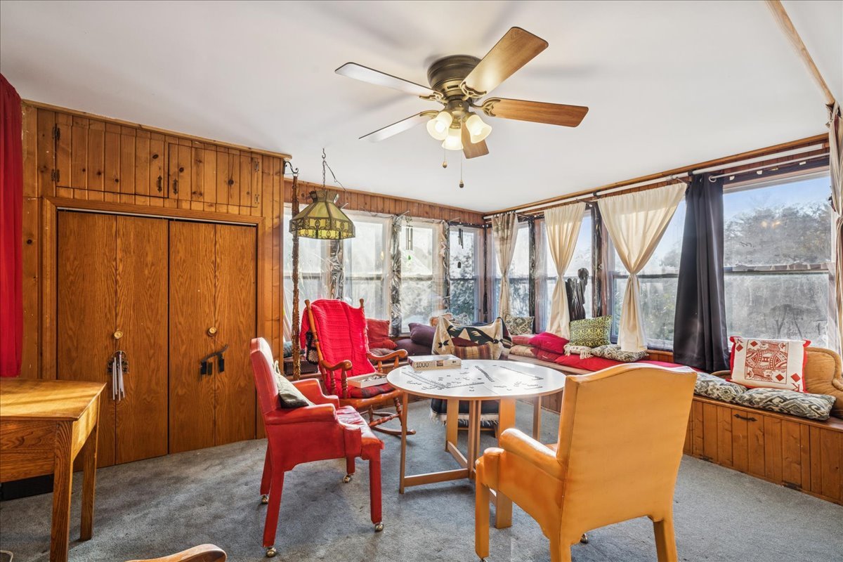 29652 West Roberts Road Island Lake, IL 60042 - Photo 4 of 13 a dining room with furniture a chandelier and a rug