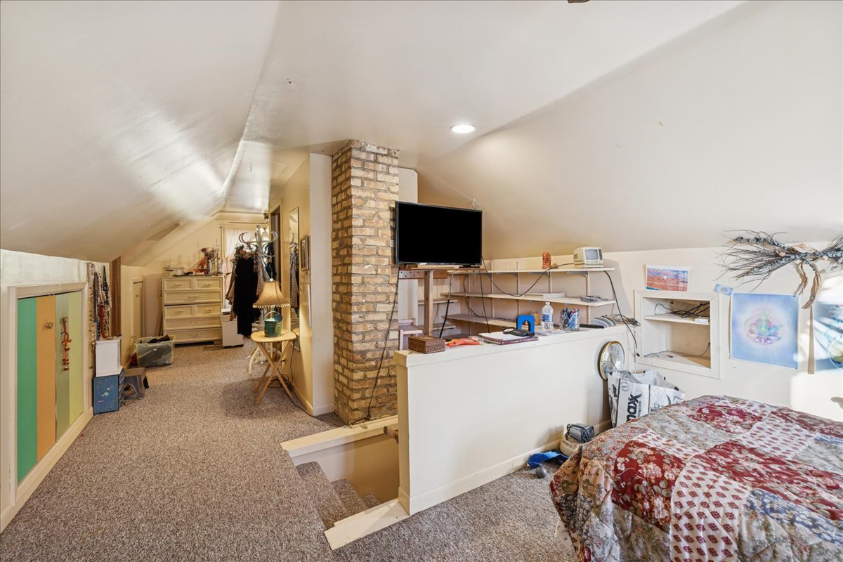 29652 West Roberts Road Island Lake, IL 60042 - Photo 10 of 13 a bedroom with furniture and a flat screen tv