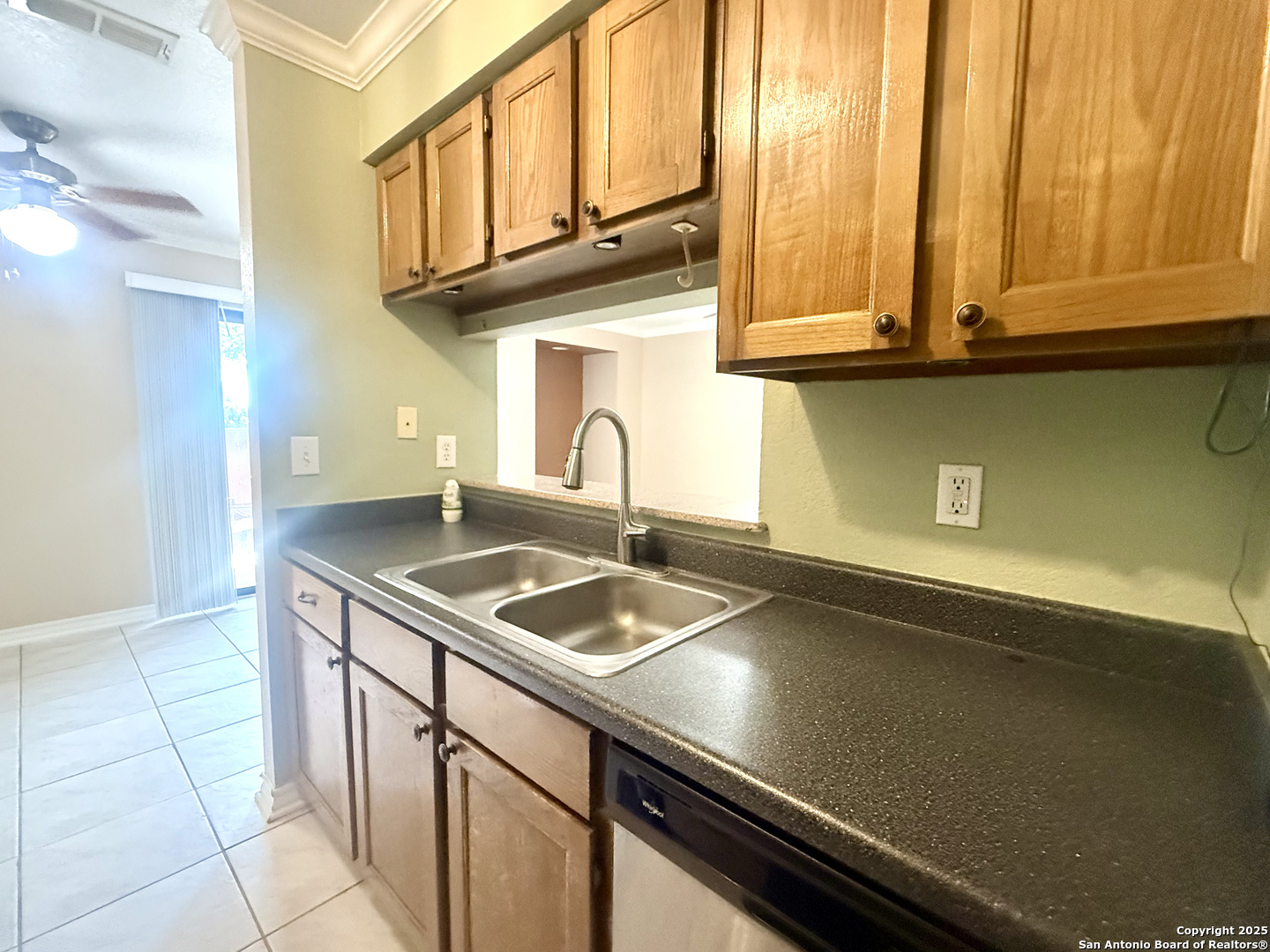 13018 Heimer, Unit 703 San Antonio, TX 78216 - Photo 13 of 28 a kitchen with a sink and cabinets