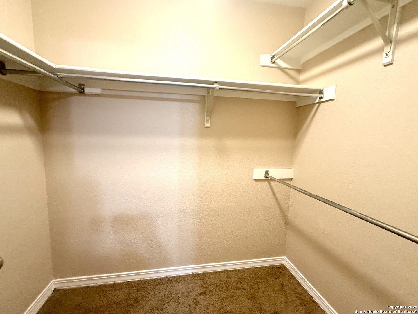 13018 Heimer, Unit 703 San Antonio, TX 78216 - Photo 16 of 28 a view of a room with racks on the wall