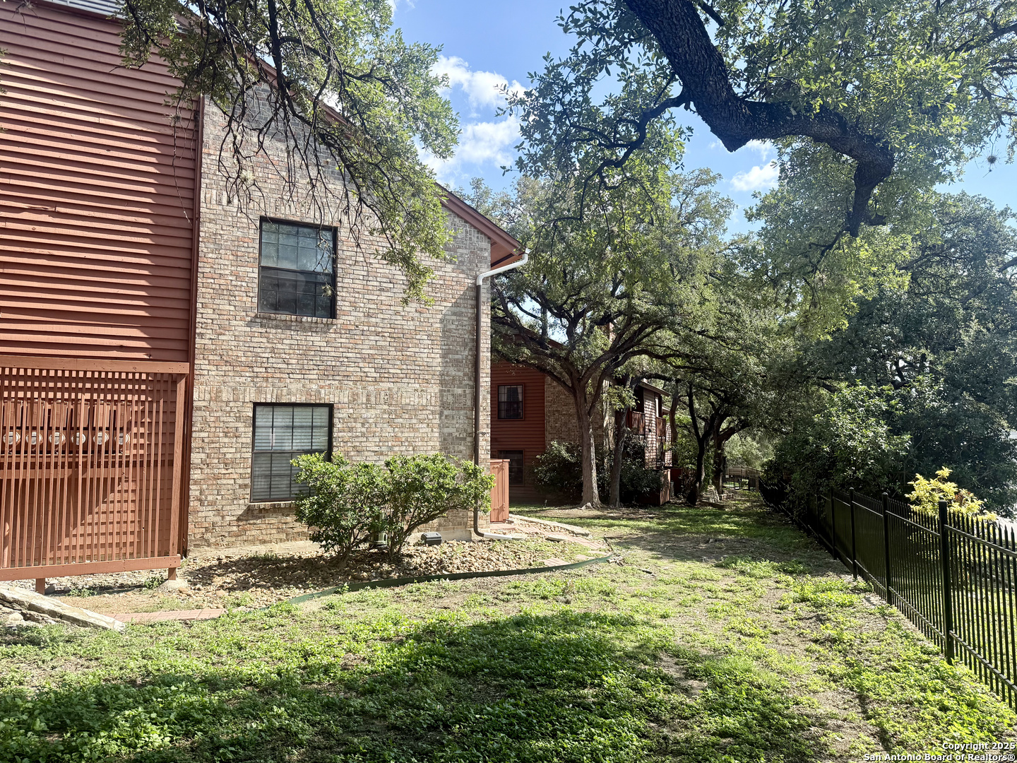 13018 Heimer, Unit 703 San Antonio, TX 78216 - Photo 19 of 28 a view of a house with a yard