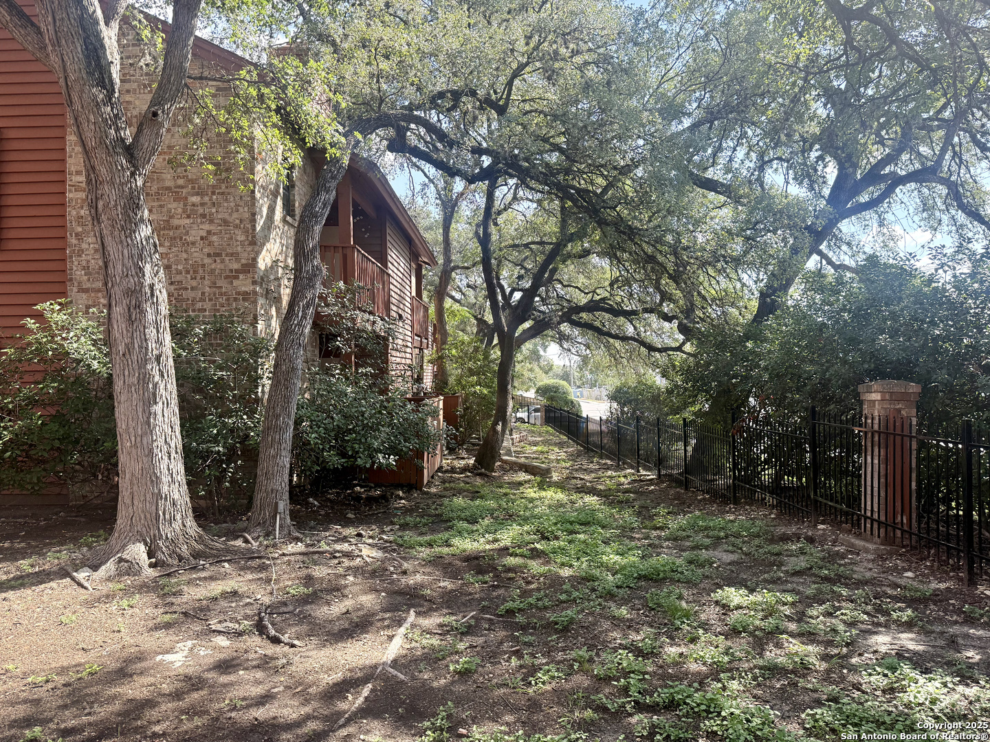 13018 Heimer, Unit 703 San Antonio, TX 78216 - Photo 20 of 28 a view of a house with a yard