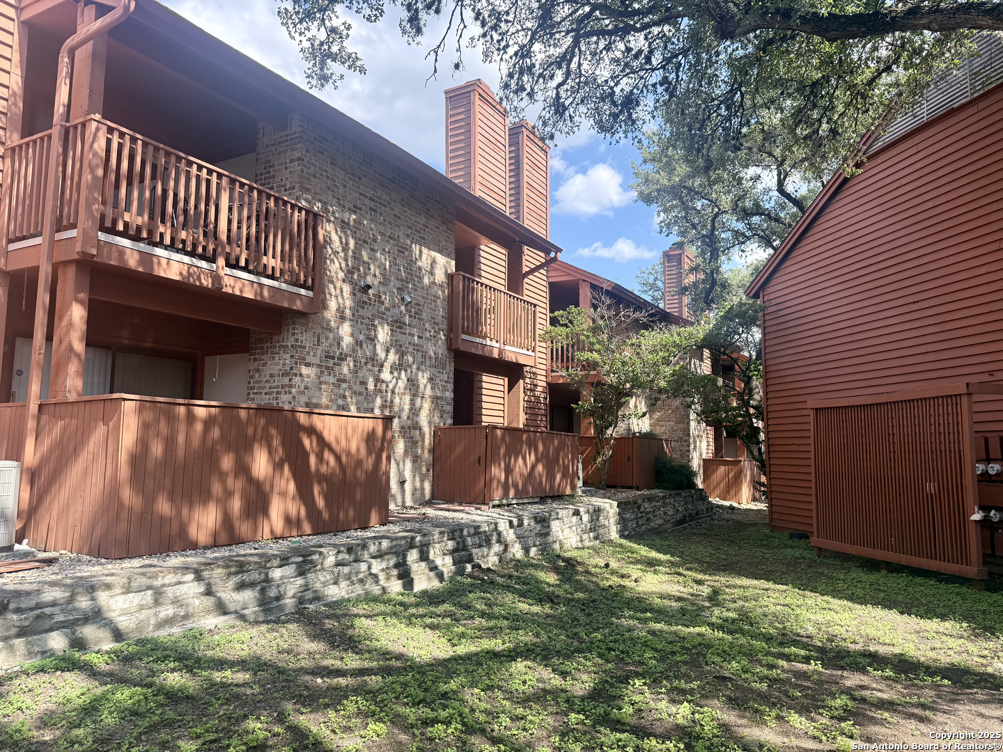 13018 Heimer, Unit 703 San Antonio, TX 78216 - Photo 21 of 28 a view of a house with a yard