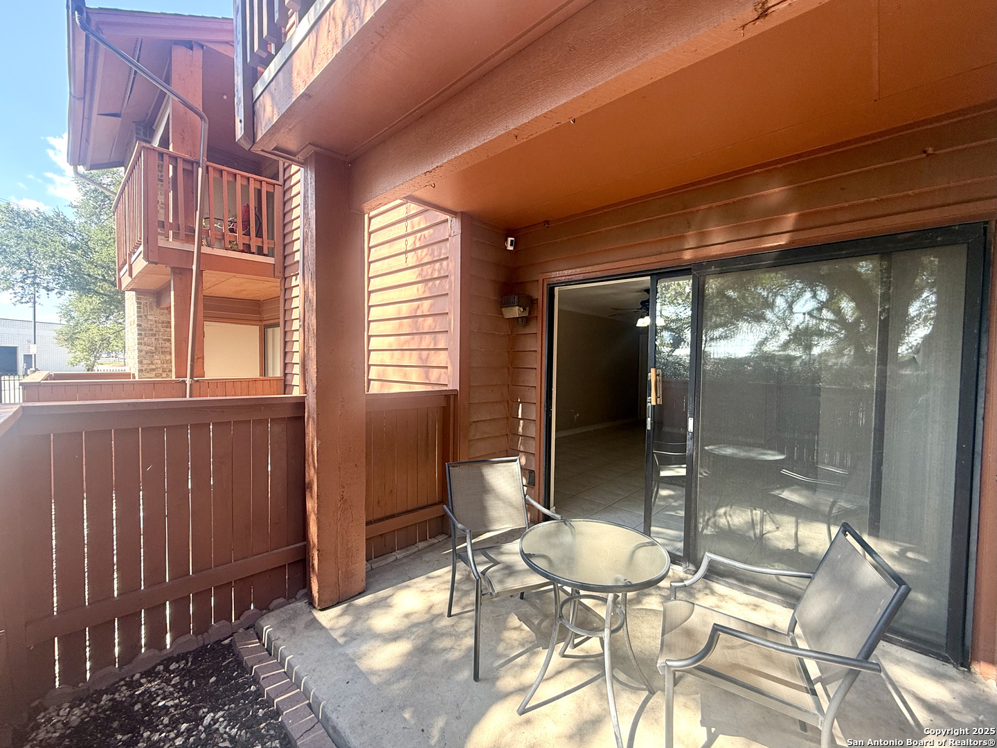 13018 Heimer, Unit 703 San Antonio, TX 78216 - Photo 22 of 28 a view of a patio with table and chairs and potted plants